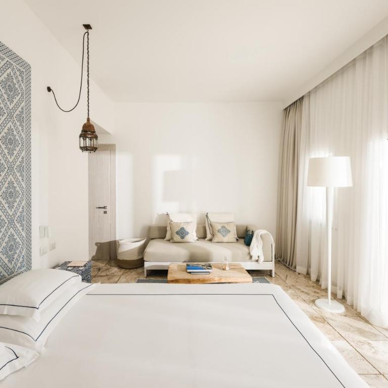 Falkensteiner Resort Capo Boi - Suite Familiare con Balcone e Vista Parco - 1