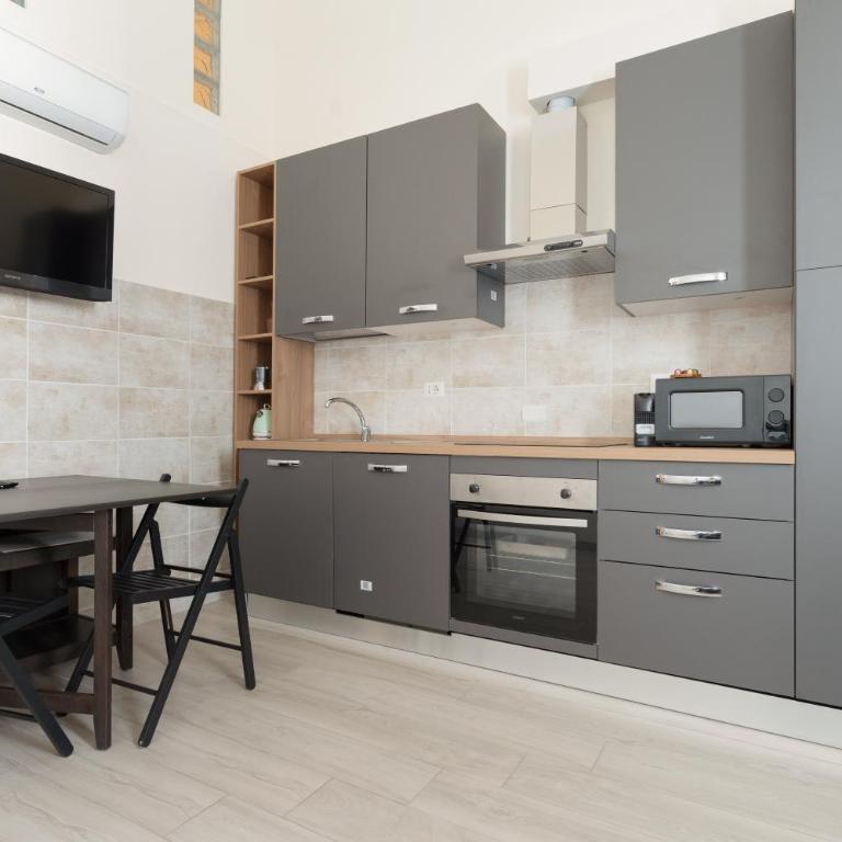 GuestHost - Cozy Loft with Mezzanine Milan - Appartamento con 1 Camera da Letto - 11