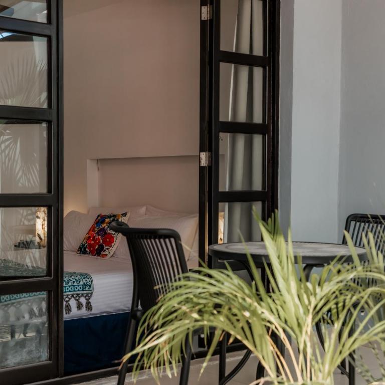 Mojarra Condo Boutique - Suite con cama grande y balcón - 6