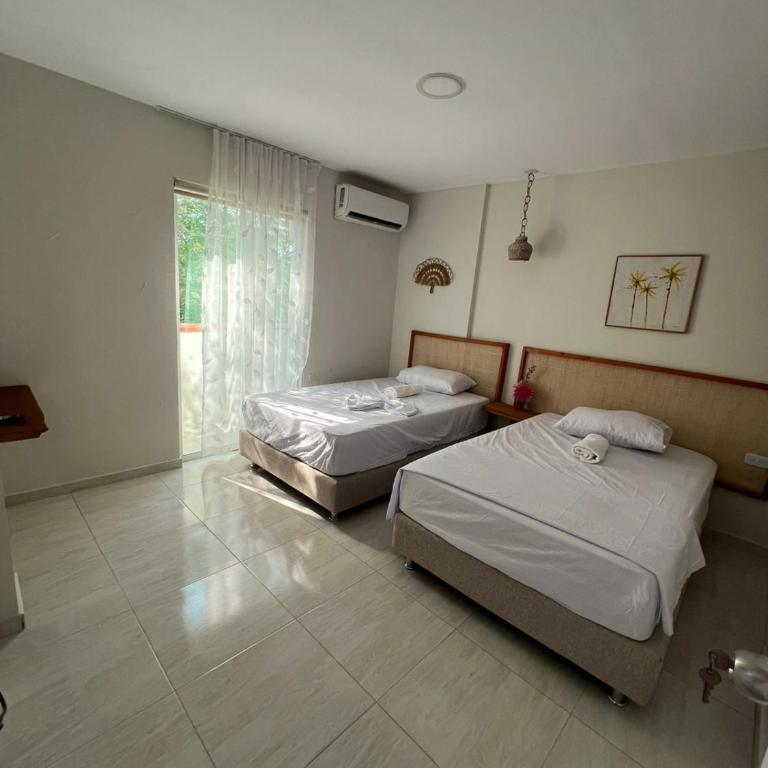 Aparta hotel brisas Del tayrona - Habitación Doble con vistas a las montañas - 2 camas - 6