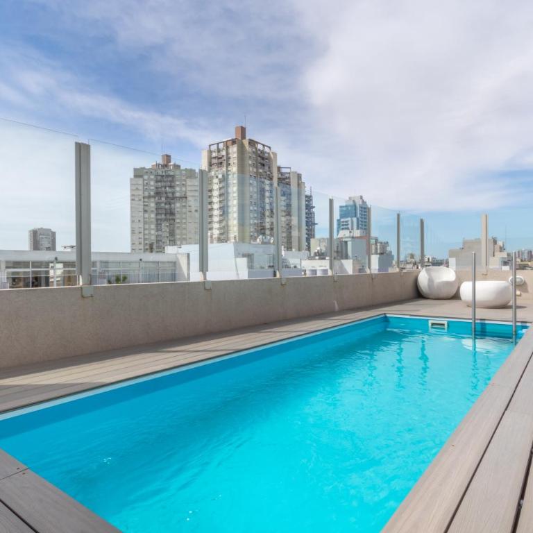 Exclusivo con pileta, cochera, parrilla, cerca del hospital - Apartamento de 1 dormitorio - 34