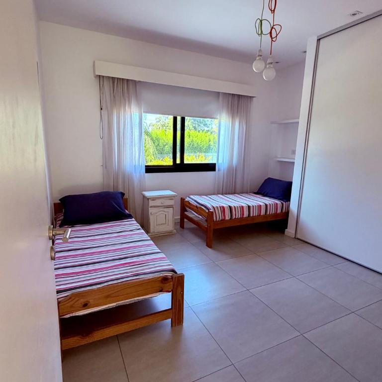 Casa con jardín y piscina en Estancias del Pilar - Casa de 4 dormitorios - 22