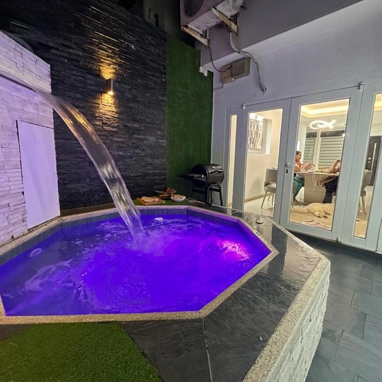 Casa con jacuzzi en La Aurora, Guayaquil, 3 habitaciones, ideal para familias, con sala, comedor y cocina equipada - Three-Bedroom Apartment - 27
