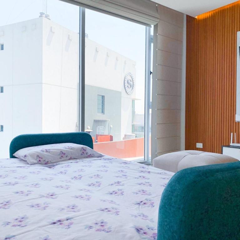 Suite cerca del aeropuerto, frente a Mall del Sol con vista panorámica - One-Bedroom Apartment with City View - 4