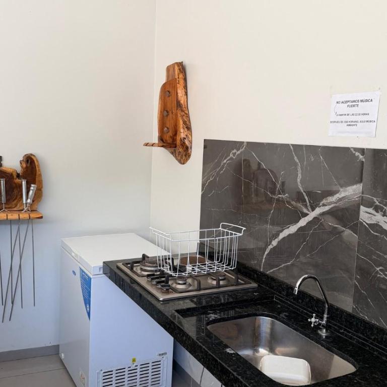 Large barbecue area with a swimming pool and a spacious room - One-Bedroom Apartment - 1