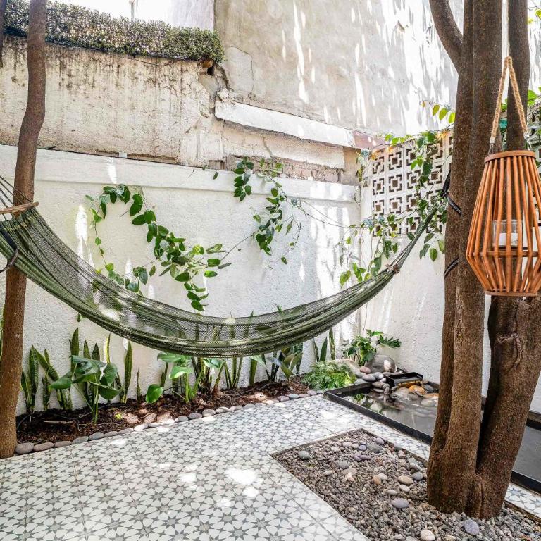 Private Oasis - Jacuzzi - Hammock - Water Feature - Two-Bedroom Deluxe Apartment with Garden View - 10
