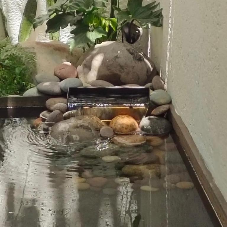 Private Oasis - Jacuzzi - Hammock - Water Feature - Two-Bedroom Deluxe Apartment with Garden View - 11
