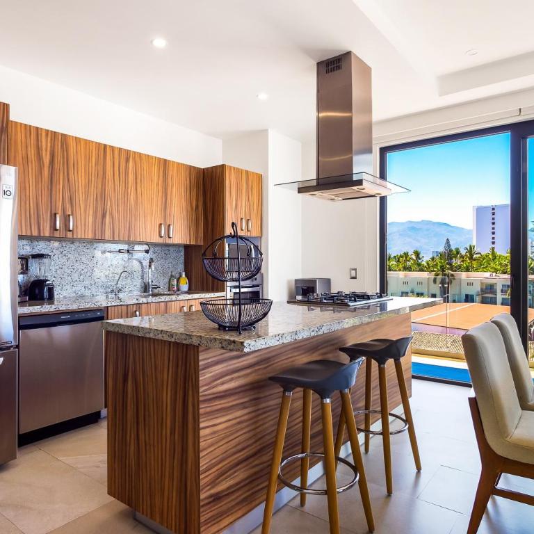 5th-floor condo with partial ocean views, heated pool, sauna, gym, balcony, W/D - Vacation Home - 14