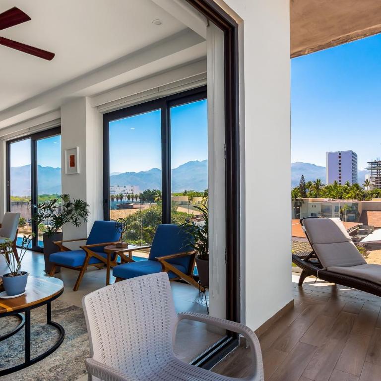5th-floor condo with partial ocean views, heated pool, sauna, gym, balcony, W/D - Vacation Home - 6