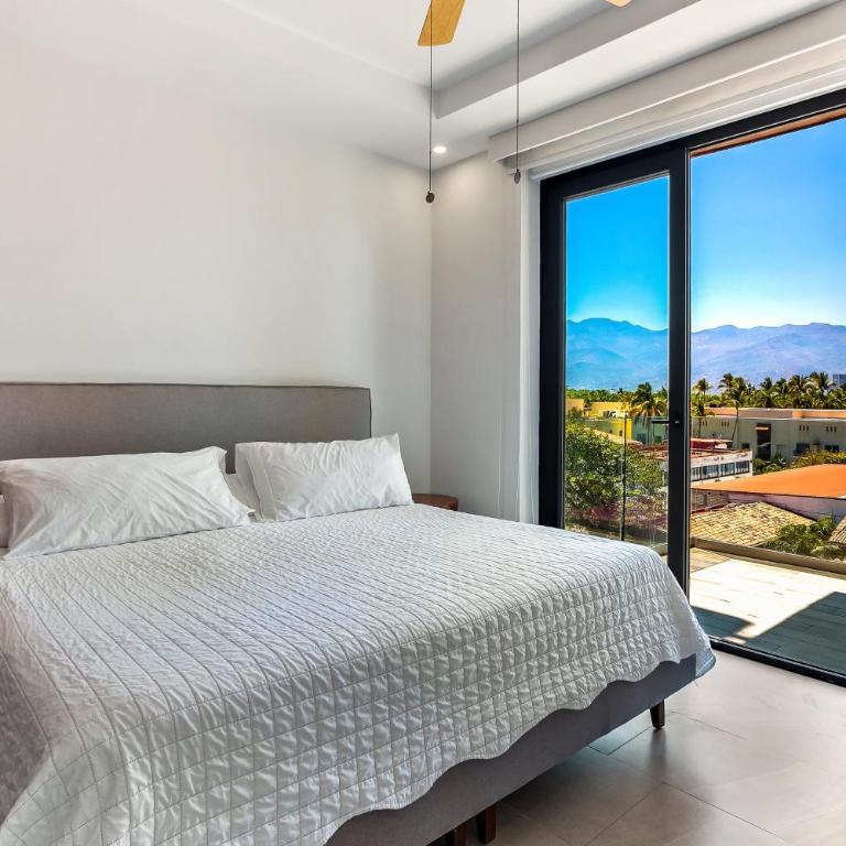 5th-floor condo with partial ocean views, heated pool, sauna, gym, balcony, W/D - Vacation Home - 18