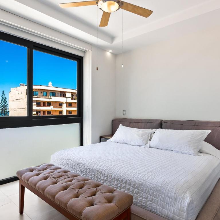 5th-floor condo with partial ocean views, heated pool, sauna, gym, balcony, W/D - Vacation Home - 20