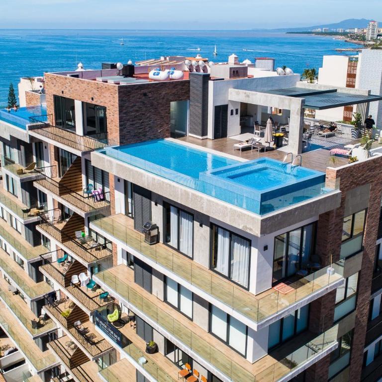 5th-floor condo with partial ocean views, heated pool, sauna, gym, balcony, W/D - Vacation Home - 33