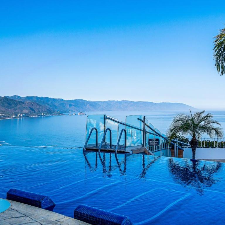 Upscale bayview villa with hot tub, private terrace, pool & stylish interiors - Vacation Home - 60