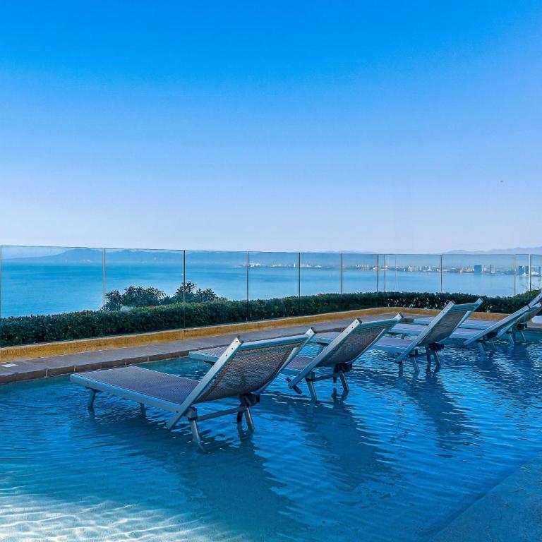Upscale bayview villa with hot tub, private terrace, pool & stylish interiors - Vacation Home - 58