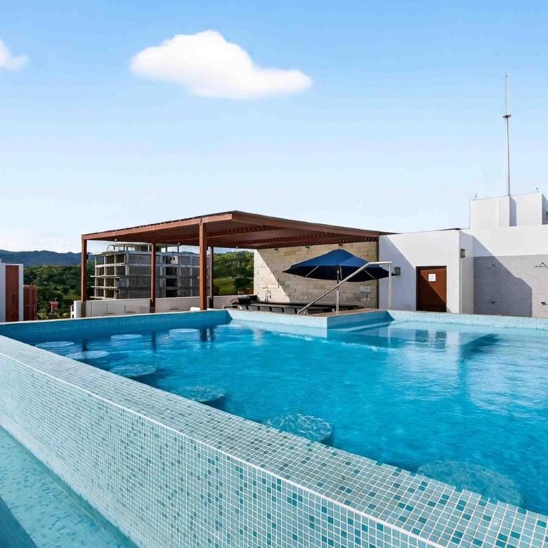 Relaxing condo with rooftop pool, oceanview balcony & walkable beach access - Casa - 28