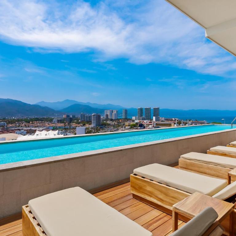 Resort condo with balcony, views, rooftop pool, gym, & full kitchen - Vacation Home - 22