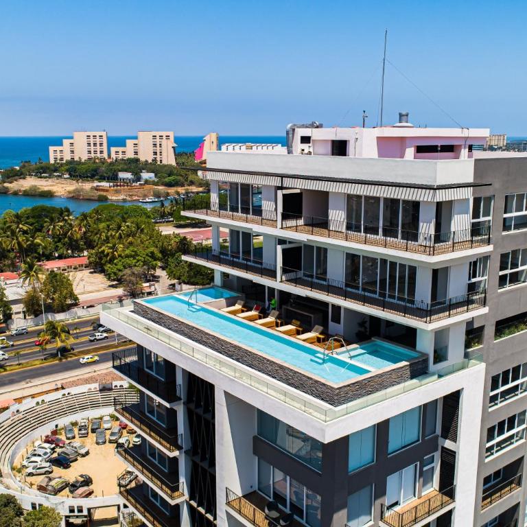 Resort condo with balcony, views, rooftop pool, gym, & full kitchen - Vacation Home - 3