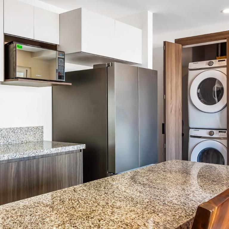 Resort condo with balcony, views, rooftop pool, gym, & full kitchen - Vacation Home - 8