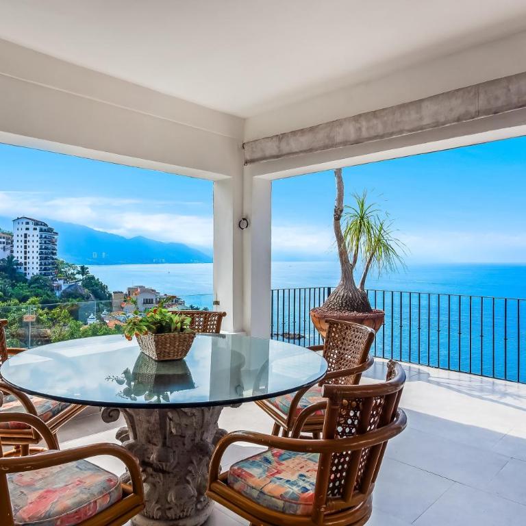 Bright ocean-view 2-story condo near beach with pool, balcony & full kitchen - Vacation Home - 30