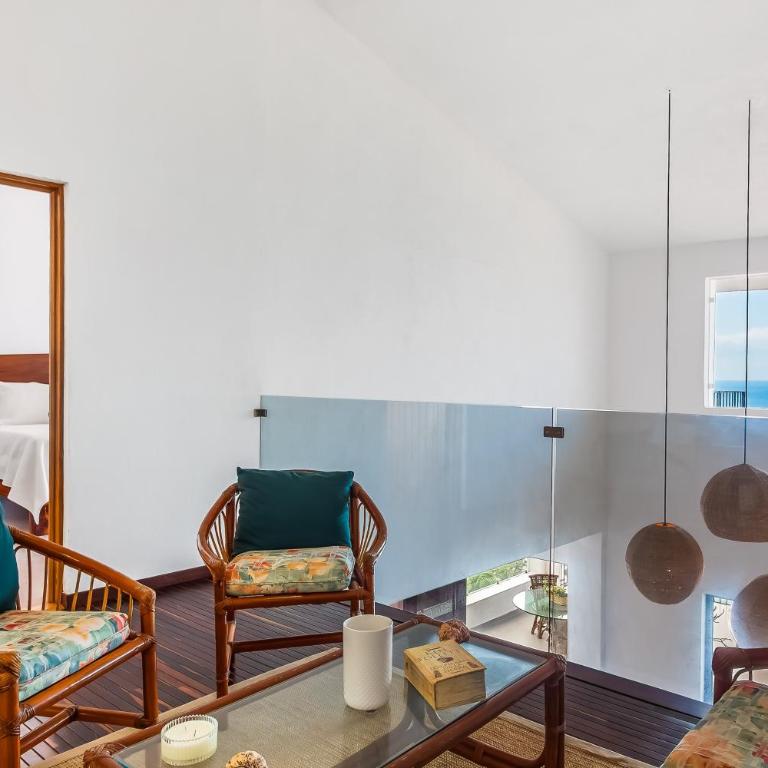 Bright ocean-view 2-story condo near beach with pool, balcony & full kitchen - Vacation Home - 13