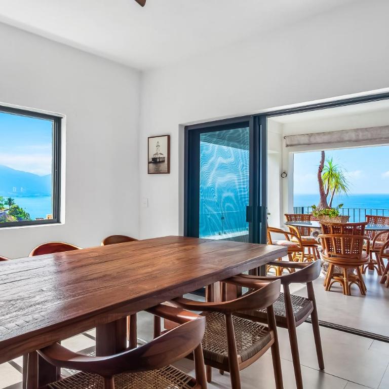 Bright ocean-view 2-story condo near beach with pool, balcony & full kitchen - Vacation Home - 16