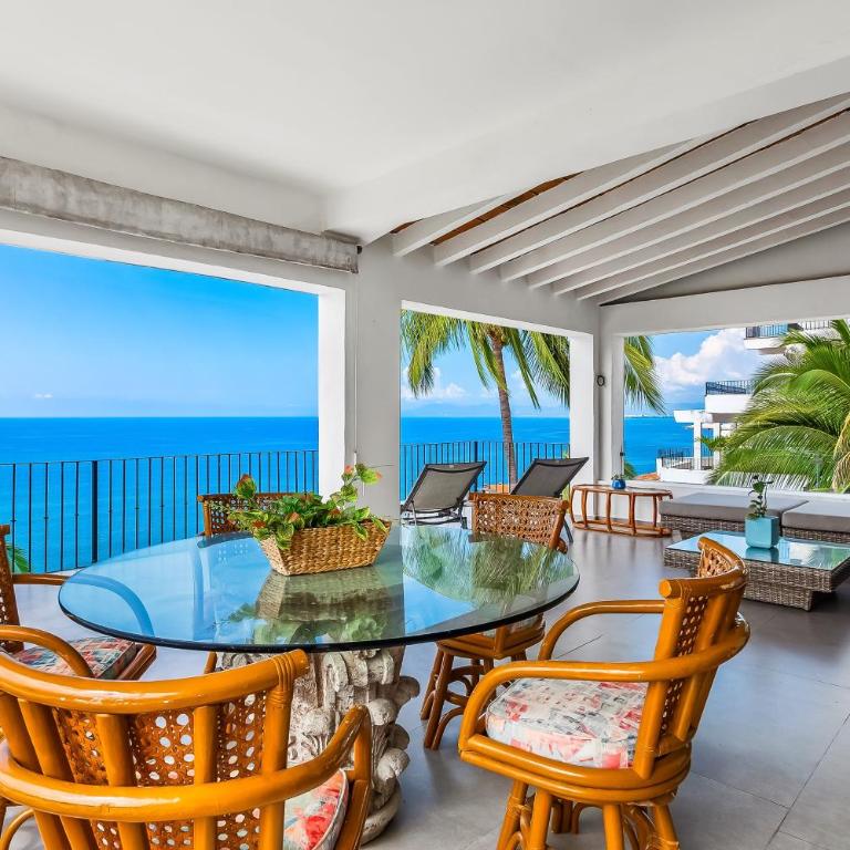 Bright ocean-view 2-story condo near beach with pool, balcony & full kitchen - Vacation Home - 4