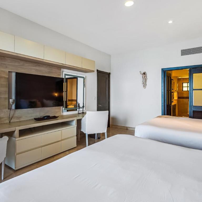Cozy beachfront apartment with stunning ocean views and resort amenities - Vacation Home - 24