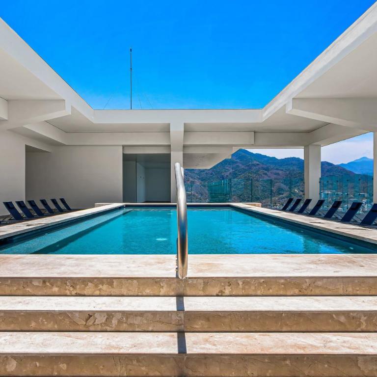 Stylish oceanfront condo with infinity pool, rooftop deck & beach access - Vacation Home - 30