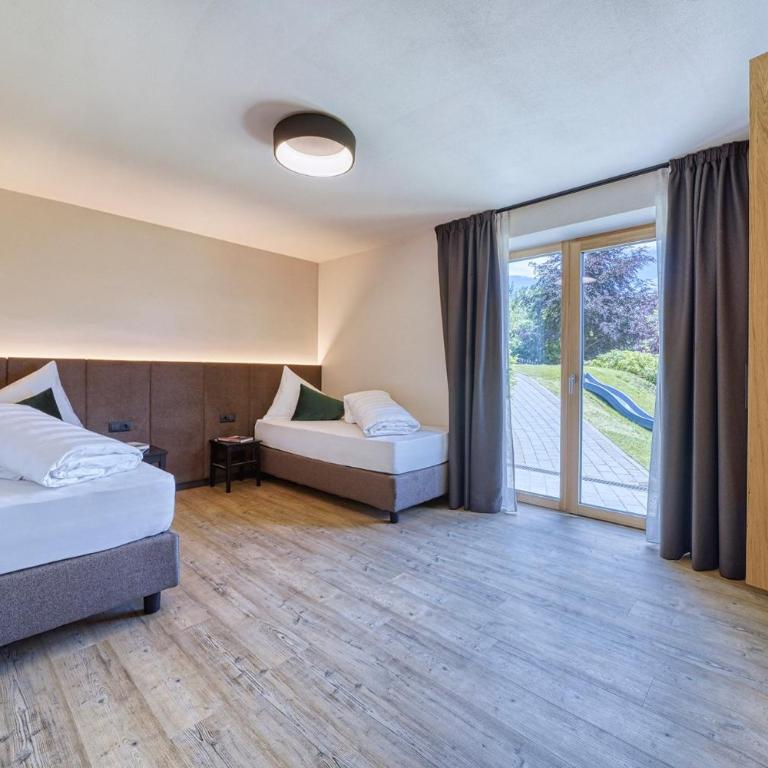 Chalet Schlossberg Rosengarten - Appartamento Deluxe con 2 Camere da Letto e Vista Giardino - 11