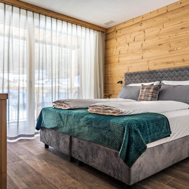 Arnica Alpin Lodge - Deluxe-Apartment mit 2 Schlafzimmern und Gartenblick - 8