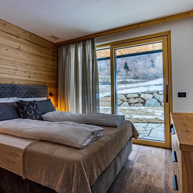 Arnica Alpin Lodge - Deluxe-Apartment mit 2 Schlafzimmern und Gartenblick - 5