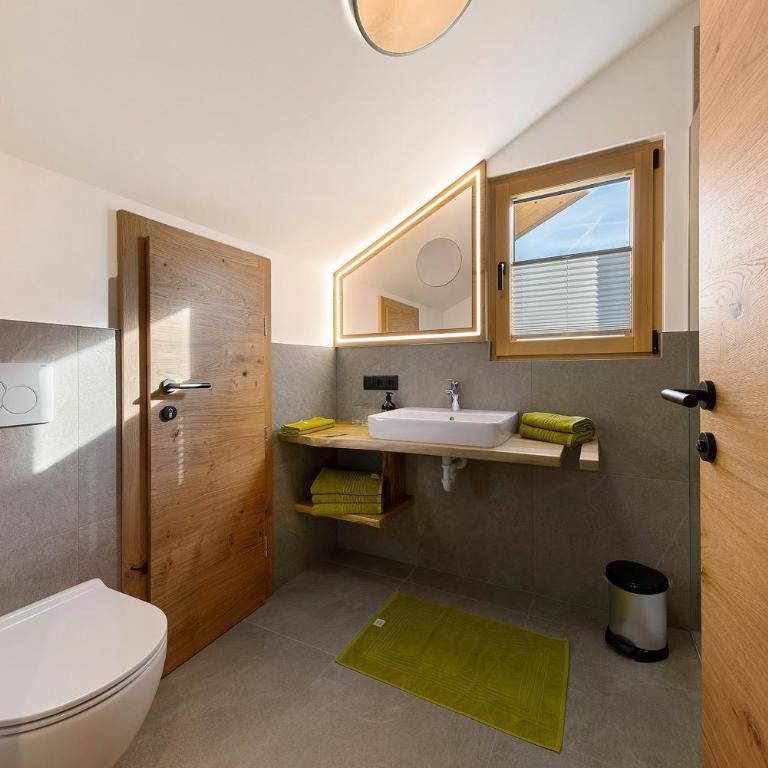 Apartments Schlernheim - Appartamento Deluxe con 2 Camere da Letto e Vista Giardino - 14