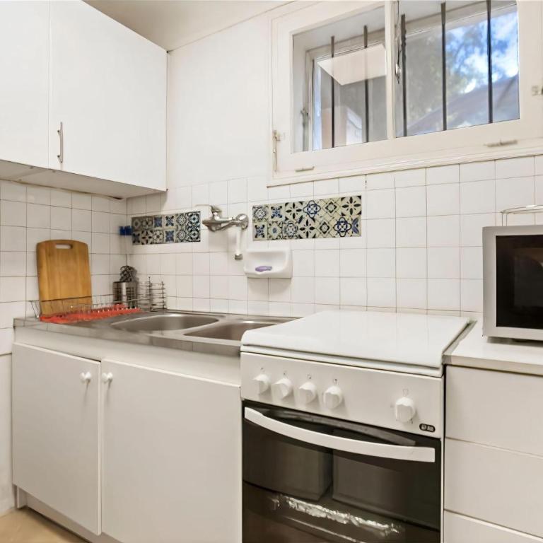 Appartement avec clim et terrasse - Appartamento Deluxe con 2 Camere da Letto e Vista Giardino - 10