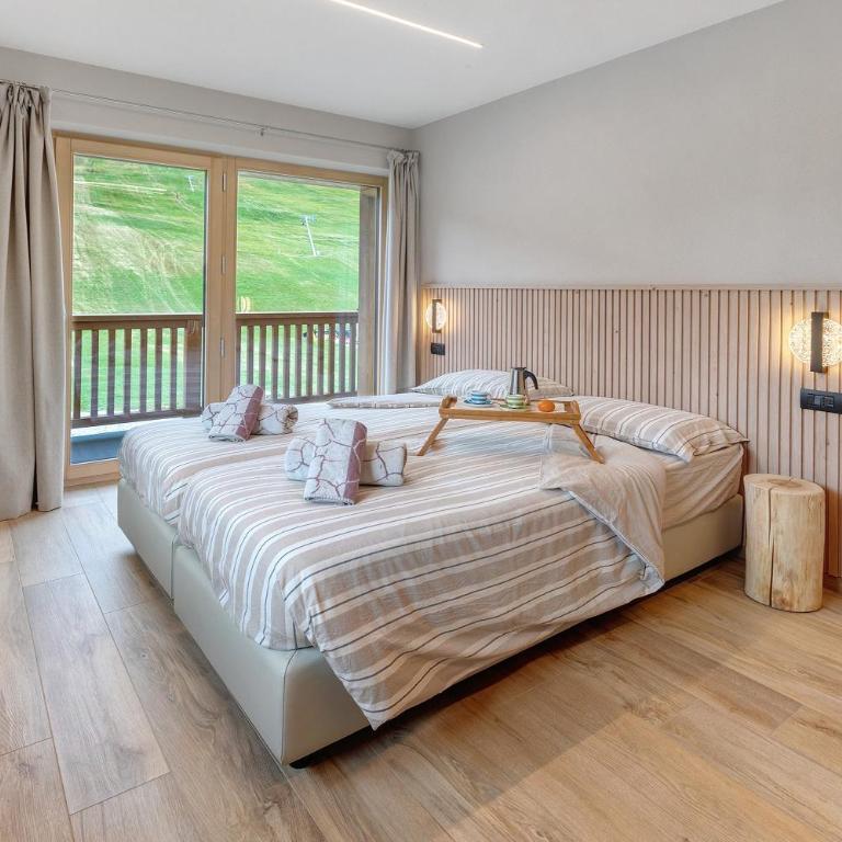 Appartamento Sbuffo Livigno - Appartamento Deluxe con 2 Camere da Letto e Vista Giardino - 15