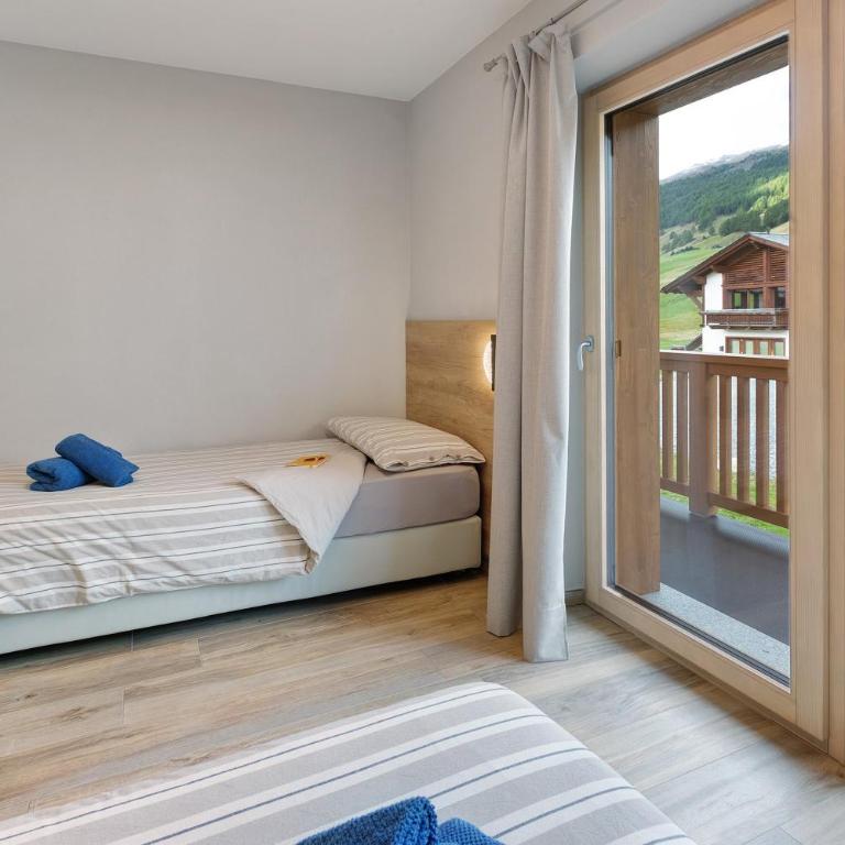 Appartamento Sbuffo Livigno - Appartamento Deluxe con 2 Camere da Letto e Vista Giardino - 27