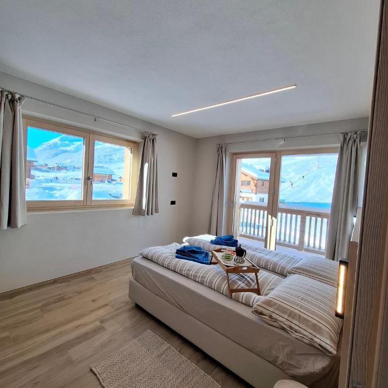 Appartamento Sbuffo Livigno - Appartamento Deluxe con 2 Camere da Letto e Vista Giardino - 17