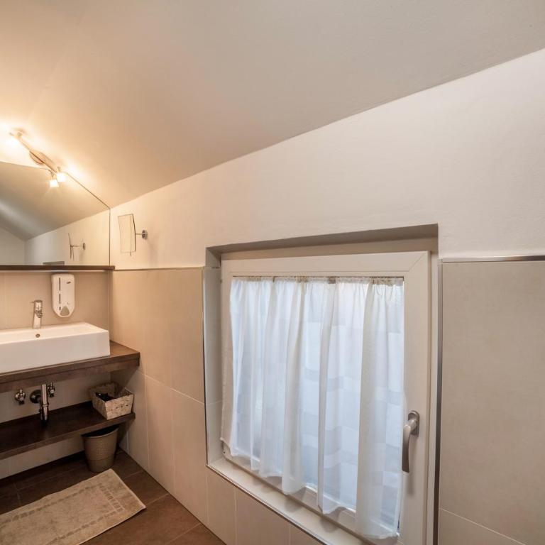 Schnitzer Ferienwohnung Anemone - Appartement 1 Chambre - Vue sur Jardin - 14