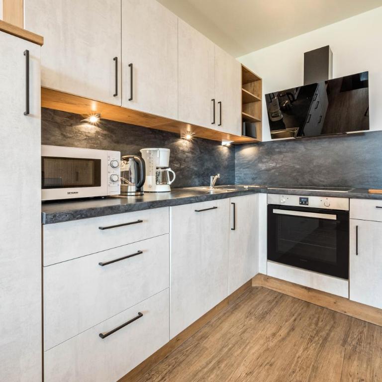 Residence Condor Apt Rosengarten - Appartamento Deluxe con 2 Camere da Letto e Vista Giardino - 8