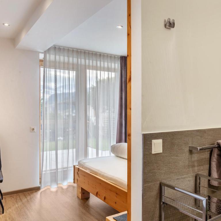 Apart-hochzillertal Gartenwohnung - Apartment mit 3 Schlafzimmern und Bergblick - 12