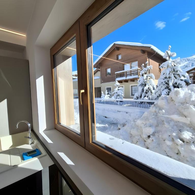 Chalet Ale Livigno - Appartamento Deluxe con 2 Camere da Letto e Vista Giardino - 10