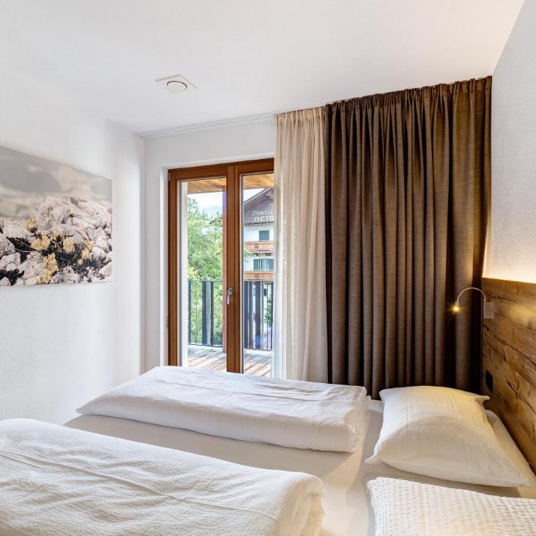Villa Kriendl Nr 3 Piz da Peres - Appartamento Deluxe con 2 Camere da Letto e Vista Giardino - 12