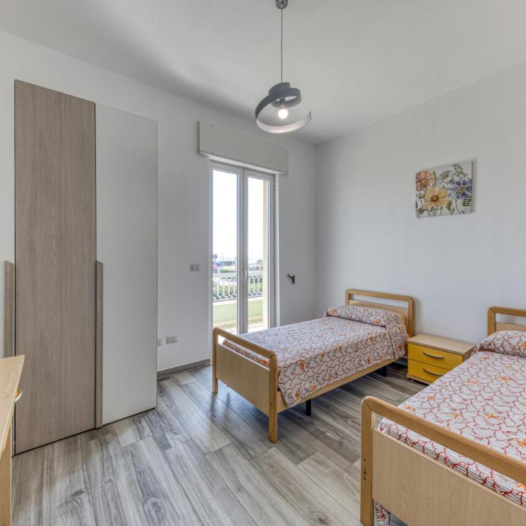 Casa Vacanze La Torre - Appartamento Premium con 3 Camere da Letto e Balcone - 10