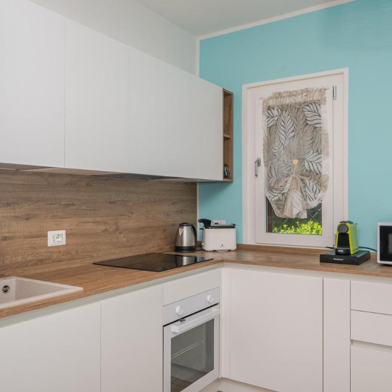 Villa Clelia - Appartamento Deluxe con 2 Camere da Letto e Vista Giardino - 19
