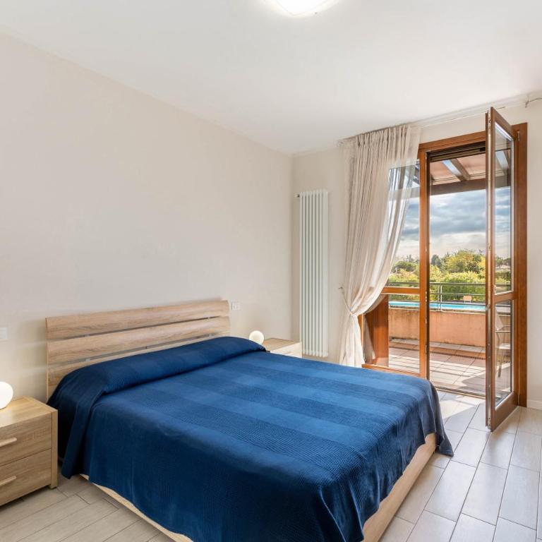 Delizioso Residence Vista Lago - Appartamento Deluxe con 2 Camere da Letto e Vista Giardino - 9