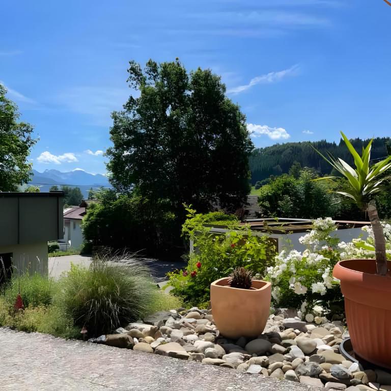 Ferienwohnung Alpenherz 80qm - Apartment mit 1 Schlafzimmer und Gartenblick - 24