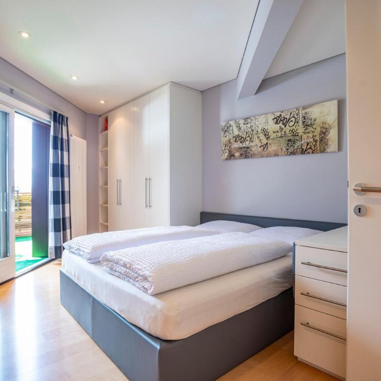 Tubris Living - Appartamento Deluxe con 2 Camere da Letto e Vista Giardino - 1