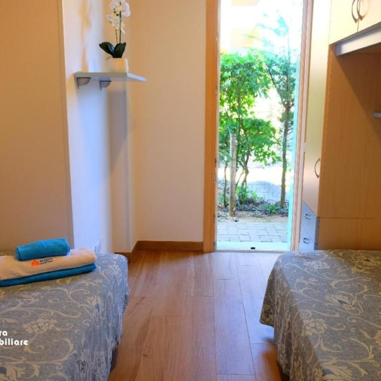 Residence Borgo dei Fiori A06 - Appartamento Deluxe con 2 Camere da Letto e Vista Giardino - 11