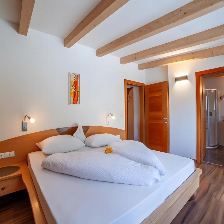 Apartments Tratter - Appartamento Deluxe con 2 Camere da Letto e Vista Giardino - 9