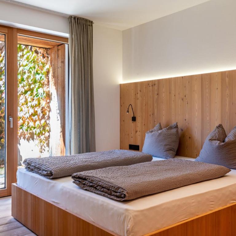 Vista Dolomites Apartment Vitality - Appartamento Deluxe con 2 Camere da Letto e Vista Giardino - 1