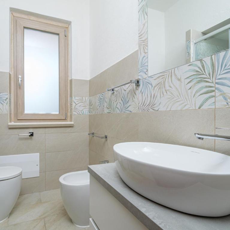 Brezza Marina Apartment- Garden - Appartamento Deluxe con 2 Camere da Letto e Vista Giardino - 11